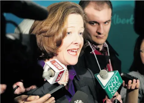  ?? P OSTM E D I A N EWS, F I L E ?? Premier Alison Redford speaks to reporters after last February’s Alberta Economic Summit in Calgary.
