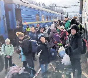  ?? ?? A new start The children from the Ukrainian orphanage are evacuated from Ukraine