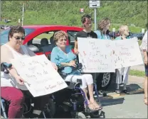  ?? GLEN WHIFFEN/THE TELEGRAM ?? Cancer patients and supporters hold a demonstrat­ion Tuesday morning near the Dr. H. Bliss Murphy Cancer Centre. The group wants Eastern Health to designate 25 parking spaces close to the centre for cancer patients.