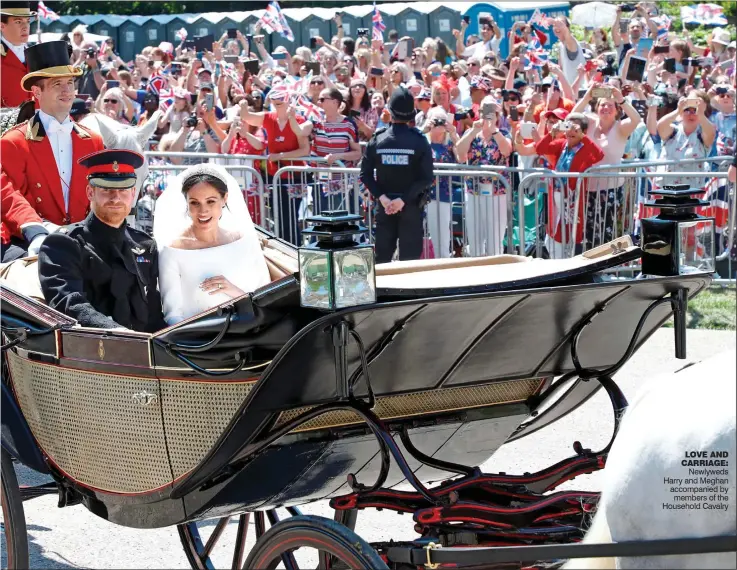  ??  ?? LOVE AND CARRIAGE: Newlyweds Harry and Meghan accompanie­d by members of the Household Cavalry