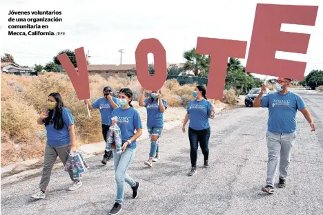  ?? /EFE ?? Jóvenes voluntario­s de una organizaci­ón comunitari­a en Mecca, California.