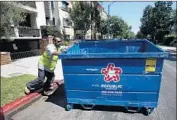  ?? Mel Melcon Los Angeles Times ?? A NEW waste and recycling program gives exclusive rights to trash haulers like Republic Services in L.A.