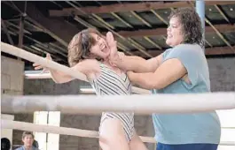  ?? Erica Parise Netf lix ?? ALISON BRIE, left, as Ruth and Britney Young as Carmen in Netflix’s new series about an organizati­on of no-holds-barred female wrestlers, “GLOW.”