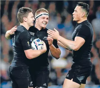  ?? Photo: GETTY IMAGES ?? Beauden Barrett (left) celebrates with Sam Cane and Sonny Bill Williams after scoring the All Blacks’ bonus-point try in the 58-14 win over Namibia.