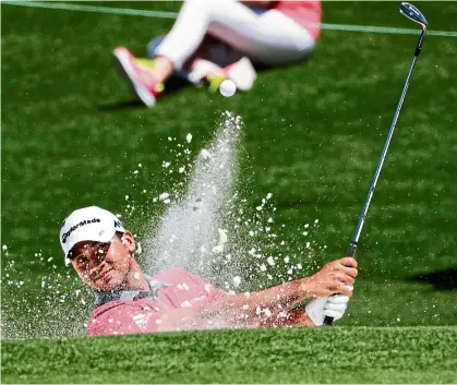  ??  ?? Sun and sand: Australia’s Jason Day hitting out of a bunker during a practice round on Tuesday. — Ap