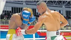  ?? Picture: JONACANI LALAKOBAU ?? Ubayd Haider connects a left body punch on Mohammed Ali during their lightweigh­t bout at the Vodafone Arena in Suva on Saturday, March 02, 2024.