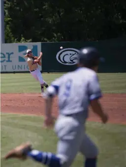  ?? Staff photo by Evan Lewis ?? Pleasant Grove’s Caleb Bolden makes the throw to first as Spring Hill’s Jacob Moore runs towards the bag Saturday in a game against Spring Hill at Hawk Field during the second and final game in the series. Bolden drove in a three run homer in the...