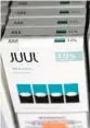  ?? MARIO TAMA/GETTY ?? A shop sells packages of Juul e-cigarettes this week in Los Angeles before the FDA’s ruling.