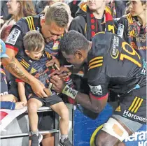  ?? Photo: Rugby Heaven ?? Pita ‘Gus’ Sowakula signs autographs for fans after his Super Rugby for the Chiefs in Hamilton on March 30,2018.