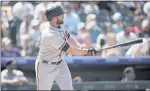  ??  ?? The Giants’ Darin Ruf hits a solo home run in the first inning on Monday in Denver.