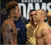  ?? Yi-Chin Lee / Staff photograph­er ?? WBC middleweig­ht champion Jermall Charlo, left, greets challenger Brandon Adams’ smile with a stone face during Friday’s weigh-in at NRG Center.