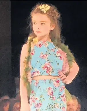  ?? GARETH DAVIES ?? Six-year-old Reegan Davies from Maesteg took to the catwalk at London Fashion Week for the House of iKons brand. She’s also been at Milan Fashion Week
