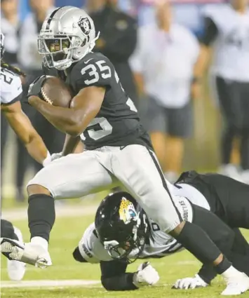  ?? DAVID RICHARD/AP ?? Raiders rookie running back Zamir White has been a fighter since before he was born.