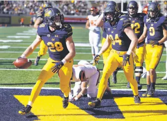  ?? Ben Margot / Associated Press ?? Cal running back Patrick Laird (28) celebrates after rushing for a touchdown against Oregon State on a day in which he ran for 214 yards and the Bears won 37-23 at Memorial Stadium.