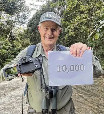  ?? PHOTOS BY PETER KAESTNER VIA THE NEW YORK TIMES ?? Peter Kaestner shows the photo he says he took of the orange-tufted spiderhunt­er in the Philippine­s on Feb. 9. With the sighting of the bird, Kaestner became the first birder to reach 10,000 species.