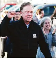  ?? Tyler Sizemore / Hearst Connecticu­t Media ?? Gov. Ned Lamont campaigns with fellow Democrats outside the District 7 polling center at Greenwich High School in Greenwich on Election Day.