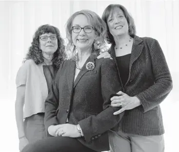  ?? CHRIS PIZZELLO/AP ?? Former Congresswo­man Gabby Giffords, center, the subject of the documentar­y “Gabby Giffords Won’t Back Down,” is seen with the film’s co-directors Julie Cohen, left, and Betsy West on June 21 in California.