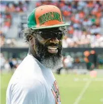  ?? MICHAEL LAUGHLIN/SUN SENTINEL ?? Ed Reed stands on the sideline during the University of Miami’s spring game April 16 at DRV PNK Stadium.