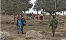  ?? Photograph: Quique Kierszenba­um/The Observer ?? Israeli volunteers Maya Eshel and Itai Feitelson escort Palestinia­n children home from school near the illegal settlement of Havat Ma’on.