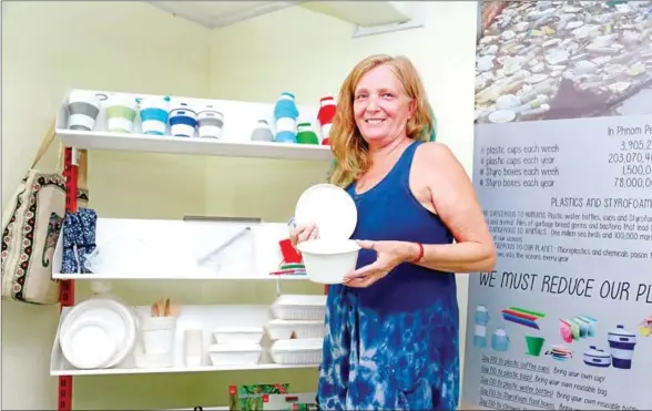  ?? HENG CHIVOAN ?? Sandy Kotan says her eco-friendly food packaging products are made of bagasse, the fibrous residue from sugarcane that biodegrade­s in just 45 days.