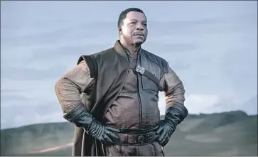  ?? MELINDA SUE GORDON Lucasfilm ?? CARL WEATHERS plays the head of a bounty hunter guild in “The Mandaloria­n” on new streamer Disney+.