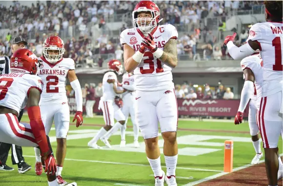  ?? University of Arkansas/Walt Beazley ?? Grant Morgan (31) made 15 tackles against Mississipp­i State despite an elbow injury.