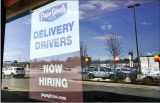  ?? ELISE AMENDOLA — THE ASSOCIATED PRESS ?? A “Now Hiring” sign last week in Salem, N.H. U.S. employers added 379,000jobs in February in a sign the pandemic’s impact on the economy is wanning.