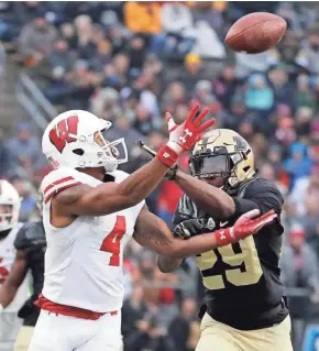  ?? MILWAUKEE JOURNAL SENTINEL ?? UW receiver A.J. Taylor hauls in a pass against Purdue last season. Taylor finished third on the team in catches (32) and had three touchdowns.
