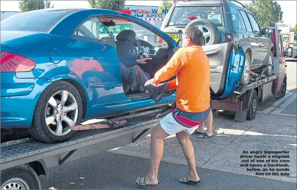  ?? Pictures: JONATHAN BUCKMASTER ?? An angry transporte­r driver hauls a migrant out of one of his cars and faces a backlash, below, as he sends him on his way