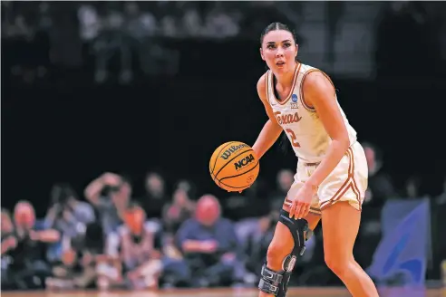  ?? HOWARD LAO/ASSOCIATED PRESS FILE PHOTO ?? Texas guard Shaylee Gonzales takes the ball up the court during the Longhorns’ Sweet 16 win over Gonzaga on Friday in Portland, Ore. Gonzales’ father — Josh Gonzales, a former standout prep player at Santa Fe High — said all of his five kids, including the former BYU and Texas sharpshoot­er, have a love for hoops.