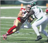  ?? ADAM HUNGER — THE ASSOCIATED PRESS ?? 49ers defensive end Nick Bosa (97) rushes against Jets offensive tackle Mekhi Becton on Sunday in East Rutherford, N.J.