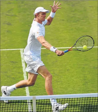  ?? Picture: GETTY IMAGES ?? BACKHAND SHOT: South Africa’s Kevin Anderson returns to Spain’s Fernando Verdasco during their Wimbledon first-round match yesterday. Anderson won 2-6 7-6(5) 7-6(8) 6-3