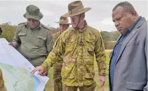 ??  ?? Minister for Foreign Affairs, Defence and Security, Inia Seruiratu being updated by the Australian Defence Force on the recovery and rebuilding works in the aftermath of the Australian Bushfires.