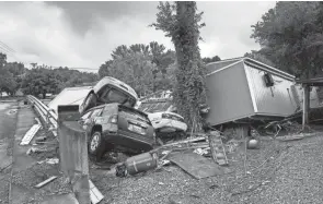  ?? ANDREW NELLES/NASHVILLE TENNESSEAN ?? More than 20 people died in the flooding that swept through Waverly, Tennessee, Saturday. As much as 17 inches of rain fell within hours in the rural area, home to about 4,000 people and 60 miles west of Nashville.