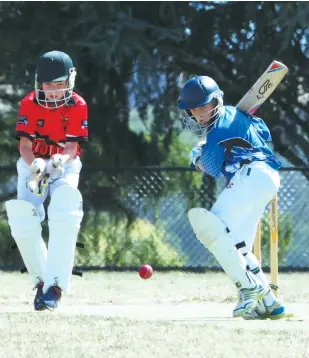  ??  ?? Western Park’s Will Hendrikse gets set to drive as Ellinbank/Warragul wicketkeep­er Bryce Joyce watches on. For a full junior cricket report, read the West Gippsland and Baw Baw Trader.