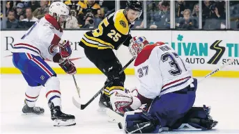  ?? MICHAEL DWYER/THE ASSOCIATED PRESS ?? Canadiens backup goalie Antti Niemi turns aside a shot by the Bruins’ Brandon Carlo in overtime in Boston Saturday as the Bruins won 2-1 despite getting 48 shots on net.