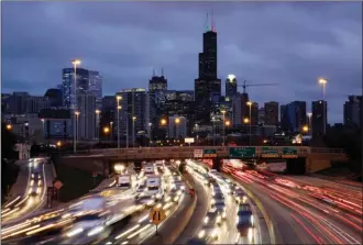  ?? Associated Press file photo ?? Traffic streaks across the John F. Kennedy Expressway at the start of the 2018 U.S. Thanksgivi­ng holiday weekend in Chicago. The Transporta­tion Security Administra­tion says it expects to screen more than 26.8 million passengers from Nov. 22 through Dec. 2 this year, a 4% increase over the comparable period last year.