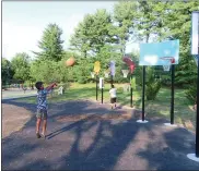  ?? DAN SOKIL — MEDIANEWS GROUP ?? Kids take shots at a series of colored basketball hoops at the recently rebuilt Whites Road Park playground on Wednesday, June 16.
