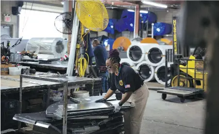  ?? AP ?? Sheet metal worker Carey Mercer assembles ductwork in New York. The constructi­on industry is fighting to recruit more women into a sector that faces chronic labour shortages. Lean In circles are helping to open doors to women in the industry in both Canada and the U.S.