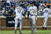  ?? JESSIE ALCHEH — THE ASSOCIATED PRESS ?? Houston Astros’ Yuli Gurriel (10) celebrates with Astros’ Kyle Tucker (30) after Gurriel hits a home run against the New York Mets on Tuesday in New York.