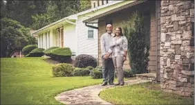  ?? Audra Melton / New York Times ?? Nash and Pam Alexander first rented their Atlanta home and went on to buy it from Divvy in March. Portraying itself as a good guy in a seedy area of home sales, the company has received mixed early reviews.