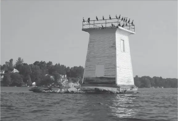  ?? LAURIE DUNNING ?? The Cole Shoal lighthouse, like the others built by the British, was a wooden structure, unlike those on the U.S. side of the river, which are still standing.