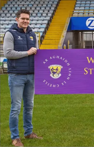  ??  ?? Shane Roche, Micheál Martin and Matthew O’Hanlon with a sign outlining the themes explored in Ar Aghaidh Le Chéile, Wexford GAA’s five-year strategic plan for 2021 to 2025.