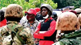  ??  ?? Uganda presidenti­al hopeful Bobi Wine wears a helmet and bulletproo­f vest due to constant clashes with security officers