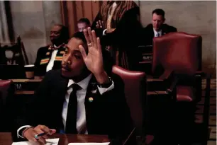  ?? NICOLE HESTER/ THE TENNESSEAN ?? Rep. Justin Jones D-Nashville, raises his hand to ask a question during a House session at the state Capitol in Nashville on Feb. 26.