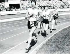  ?? ED LACEY / POPPERFOTO / GETTY IMAGES FILES ?? British middle distance runner Diane Leather leading the field in a 1957 race in London.