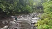  ??  ?? Slippery going … one of many river crossings on the walk to six waterfalls.