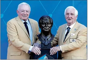  ?? AP/RON SCHWANE ?? Former executive Gil Brandt (right) stands next to his bust Saturday with Dallas Cowboys owner Jerry Jones during induction ceremonies at the Pro Football Hall of Fame in Canton, Ohio.