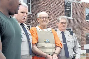  ?? GETTY IMAGES FILES ?? Edgar Ray Killen, seen being escorted by police from the Neshoba County Courthouse on Jan. 12, 2005, has died in prison at the age of 92. Killen was convicted of manslaught­er in the killings three civil rights workers in 1964.