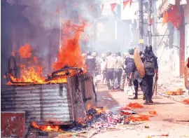  ?? PHOTO: PTI ?? Police patrol the streets after clashes and incidents of arson over a Ram Navami procession at Raniganj in the West Bardhaman district of West Bengal on Monday